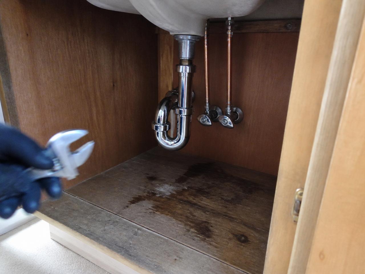 Before and after under-sink re-pipe in an Austin home